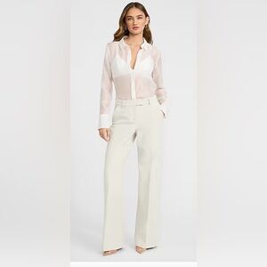 Elegant Cream Women's mid rise trousers with flare leg.